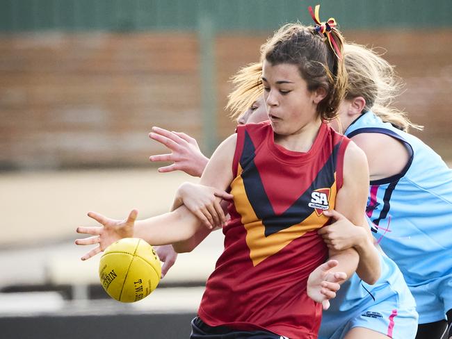 Eva Petrucci and Lily Davidson in the match between SA and NSW on day one of the SSA U12 Australian Football Championships. Picture: Matt Loxton