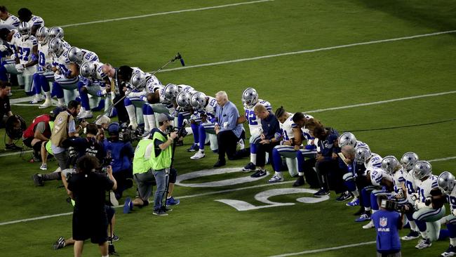 The Dallas Cowboys took a knee before the US anthem ahead of their clash with Arizona.