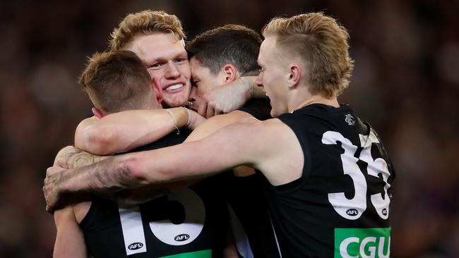 Adam Treloar celebrates last week’s win over GWS with teammates Taylor Adams, Jack Crisp and Jaidyn Stephenson. Picture: Getty Images