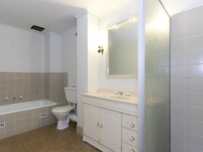 BEFORE: A bathroom in a Spruson St apartment pre-renovation.