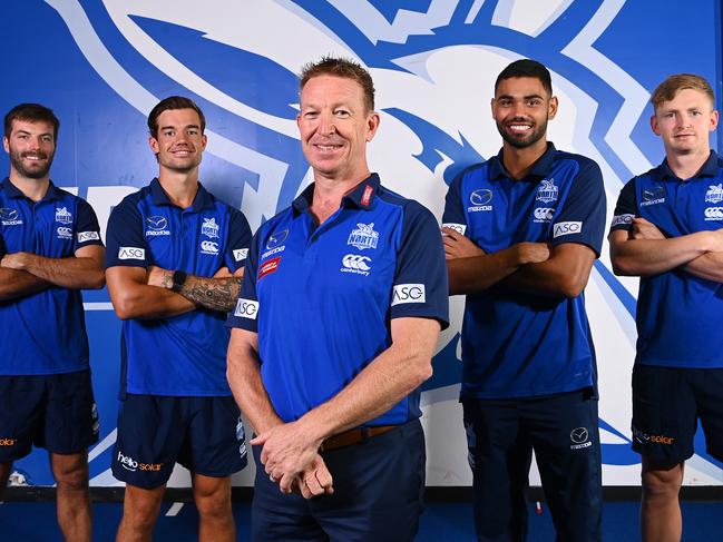 MELBOURNE, AUSTRALIA - NOVEMBER 23: New Kangaroos coach David Noble (centre)poses with Luke McDonald, Jy Simpkin, Tarryn Thomas and Jack Ziebell of the Kangaroos during a North Melbourne Kangaroos AFL media opportunity at Arden Street Ground on November 23, 2020 in Melbourne, Australia. (Photo by Quinn Rooney/Getty Images)