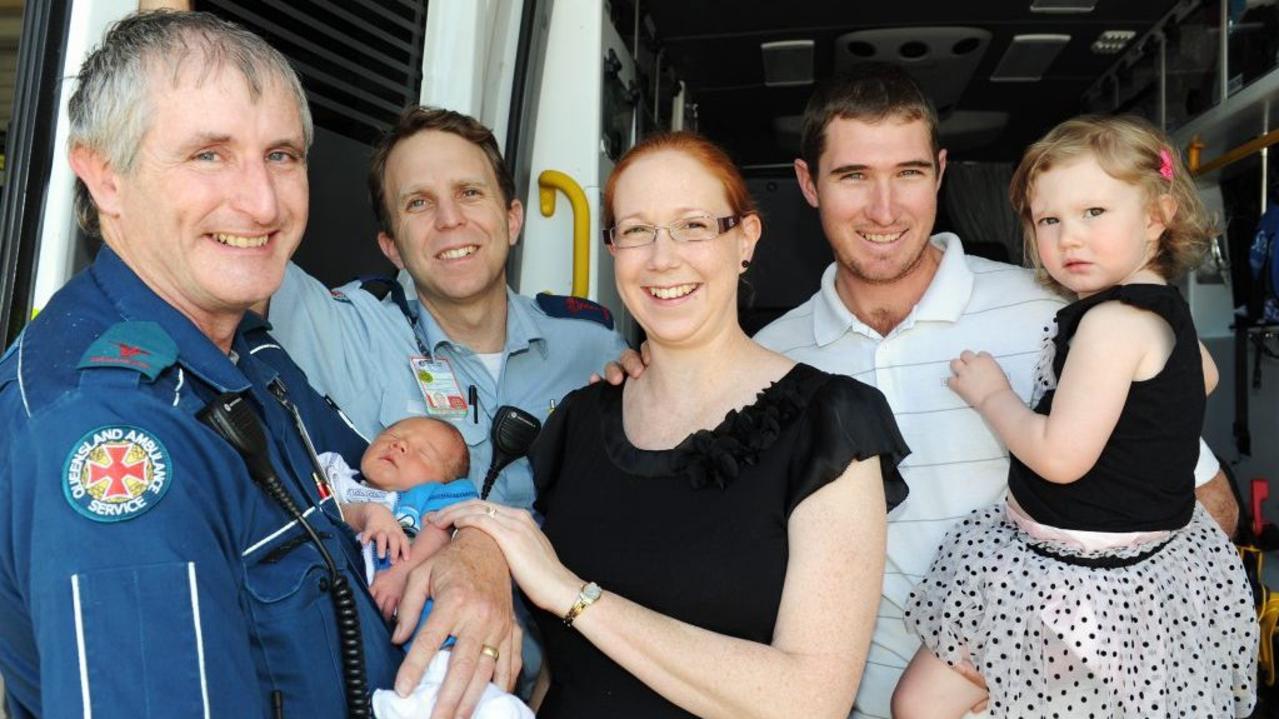 Advance Care Paramedics Kevin Brand and Simon Knight reunite with the baby they delivered in the back of their ambulance. Baby Logan, Lucinda, Robin and Calista Van Bael of Mungar. Picture: Valerie Horton