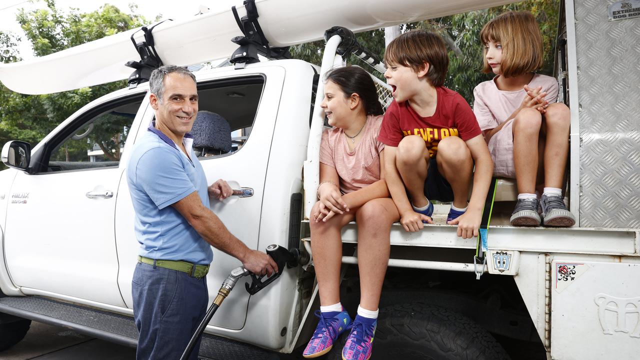 Sydneysider Saverio Russo — with kids Sofia Russo, Edoardo Russo and niece Valentina Russo — know all too well about the price pain at the bowser. Picture: Richard Dobson