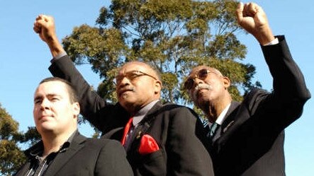 Attendees at Peter Norman's funeral, (from left) director of Salute and Peter Norman's nephew, Matt Norman, Tommie Smith and John Carlos.