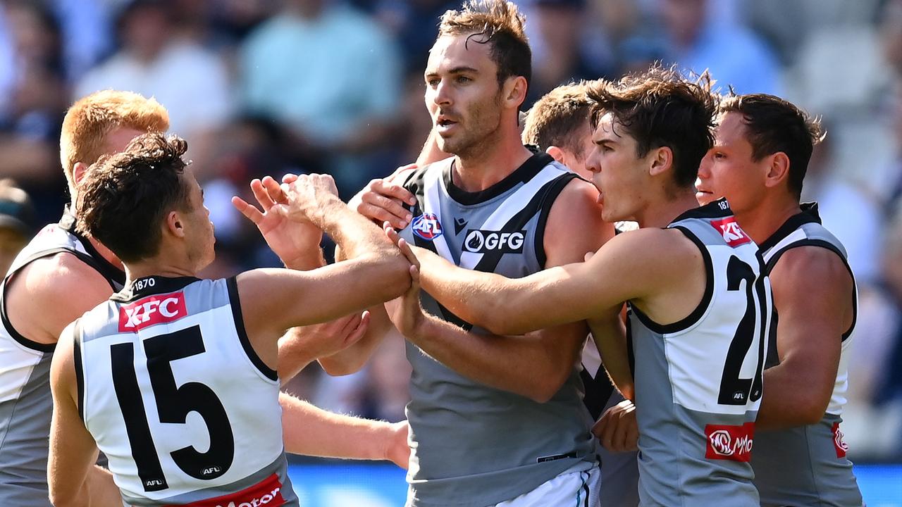 MELBOURNE, AUSTRALIA - APRIL 17: Jeremy Finlayson of the Power is congratulated by team mates after kicking a goal during the round five AFL match between the Carlton Blues and the Port Adelaide Power at Melbourne Cricket Ground on April 17, 2022 in Melbourne, Australia. (Photo by Quinn Rooney/Getty Images)