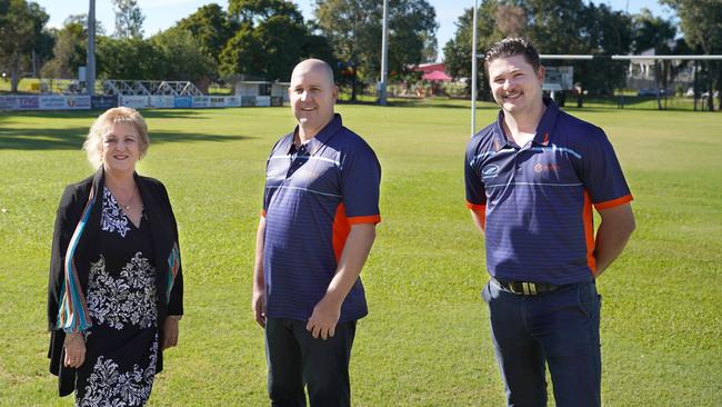 Capricornia MP Michelle Landry with Rocky Sports Club's Gavin Shuker and Jack Hughes on the grounds of Rocky Stadium.