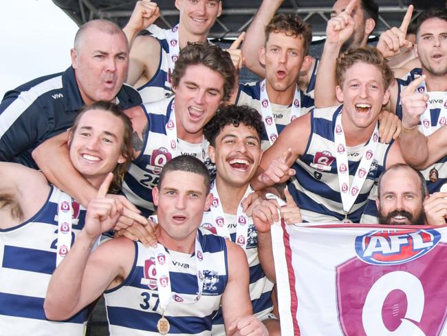 Broadbeach Cats players and coaches celebrate winning the QAFL grand final. Picture credit: Deion Menzies, Highflyer Images.