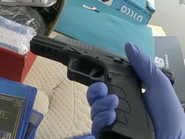 A firearm seized during the raid.