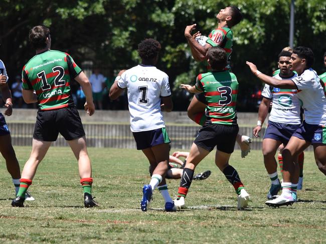 Tyrone Munro leaps high for the Rabbitohs. Picture: Sean Teuma/NewsLocal