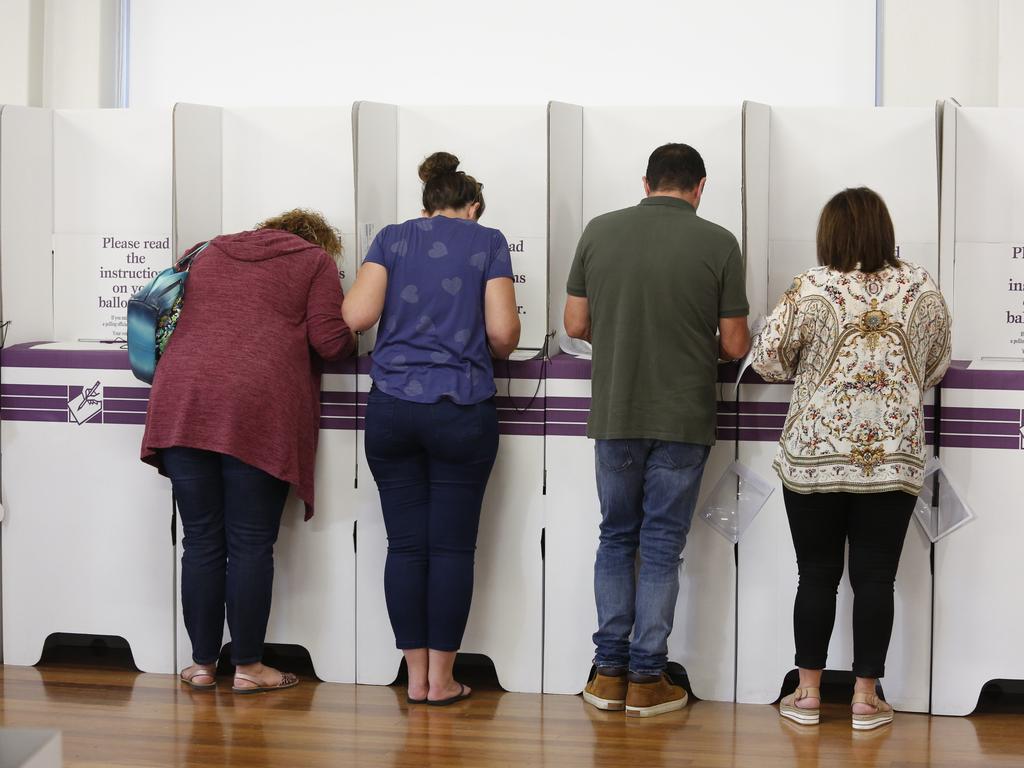 MACARTHUR CHRONICLE/AAP. Hume MP Angus Taylor hands out how to vote pamphlets at Camden Public School polling booth, Saturday, 18th May 2019. (AAP IMAGE / Robert Pozo).