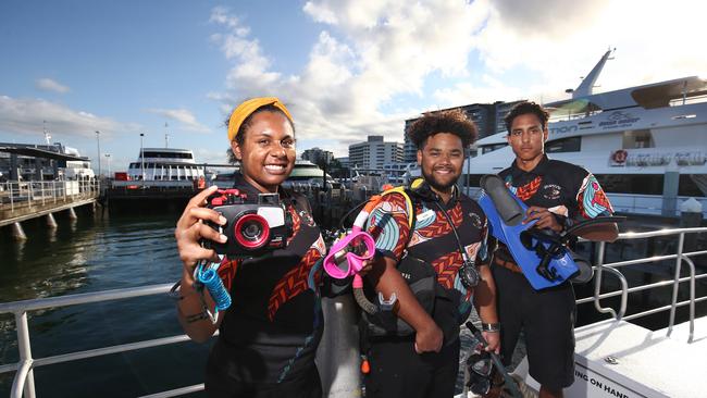 Dreamtime Dive and Snorkel’s Loreena Tim Ghee, Quinn Ross-Passi and Tala Ketchel. Picture: Brendan Radke