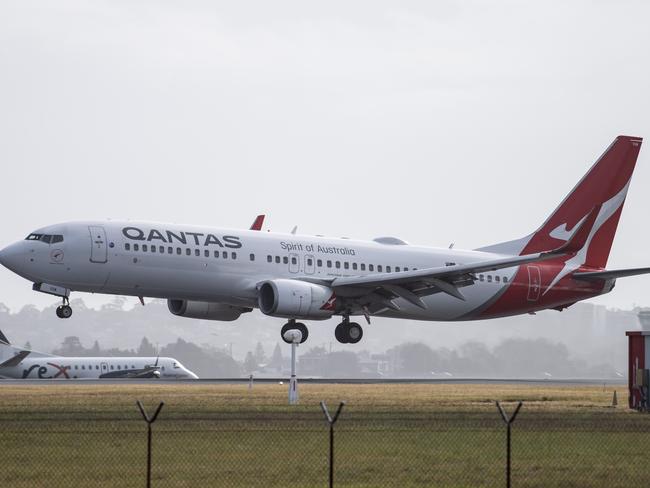 SYDNEY, AUSTRALIA - NewsWire Photos May 6, 2021: A Qantas aircraft landing at Sydney Airport.Picture: NCA NewsWire / James Gourley