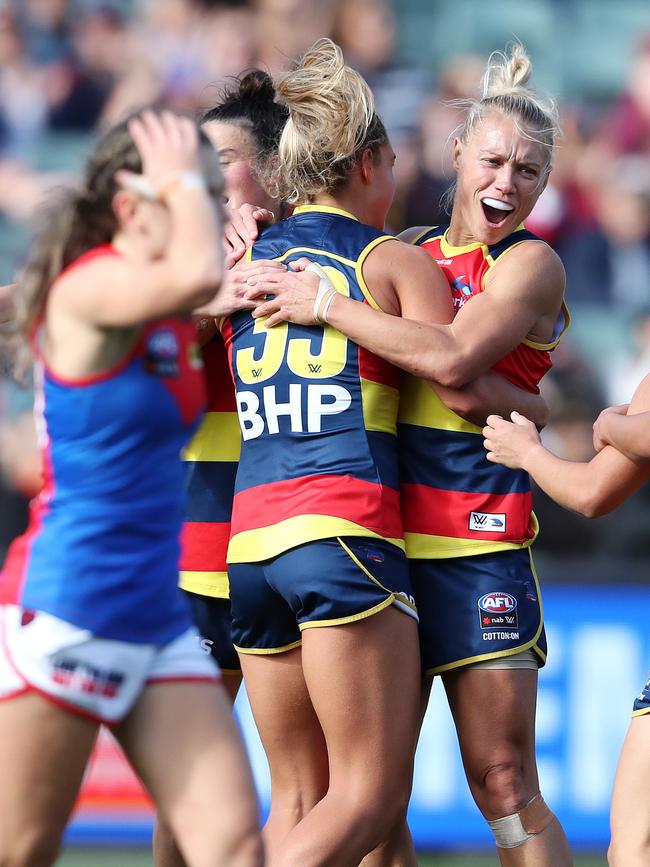 Crows midfielder Anne Hatchard (L) and Erin Phillips celebrate after a goal during the 2021 preliminary final against Melbourne at Adelaide Oval. Picture: Sarah Reed