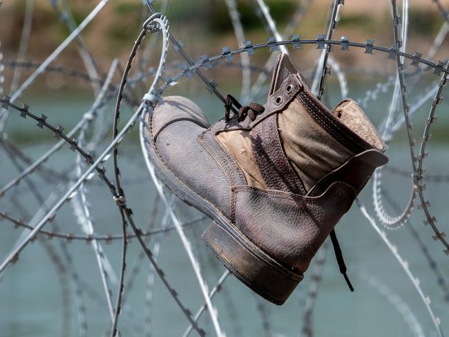A boot sits tangled in razor wire in Shelby Park. Picture: Sergio Flores