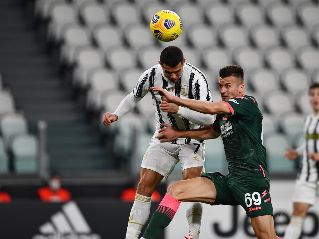 Cristiano Ronaldo of Juventus FC holds a jersey with the number 700 News  Photo - Getty Images