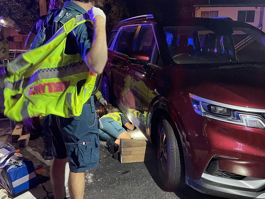 Mackay Emergency crews were called to a crash between a car and motorbike where the rider was trapped under a vehicle. Picture: Paul Brescia