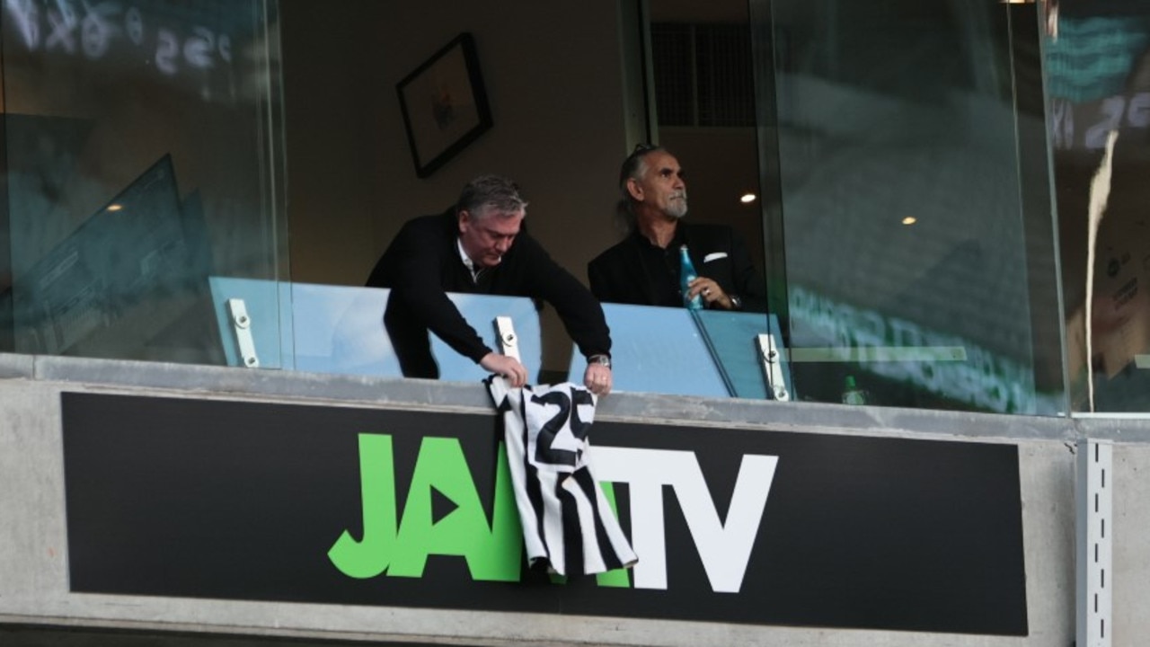 Eddie McGuire hangs Billy Picken's No.25 Collingwood jumper at the MCG. Picture: Collingwood FC Twitter