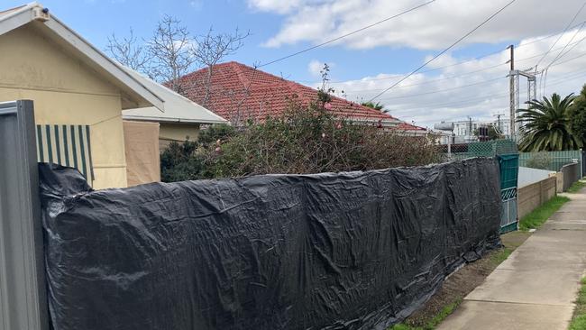 Port Adelaide Enfield Council said the Graham Street property was filled with scrap metal, hoses, brooms and bags filled with domestic waste.