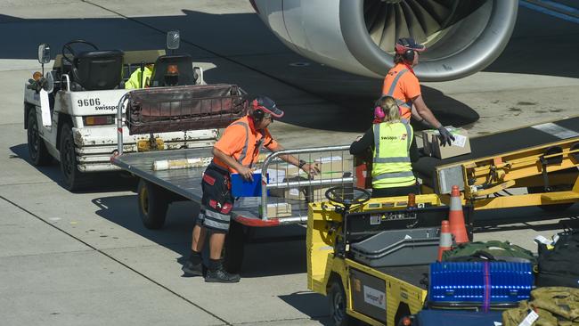 Qantas airport baggage handlers prior to the outsourcing of their jobs to companies like Swissport, Menzies and dnata.