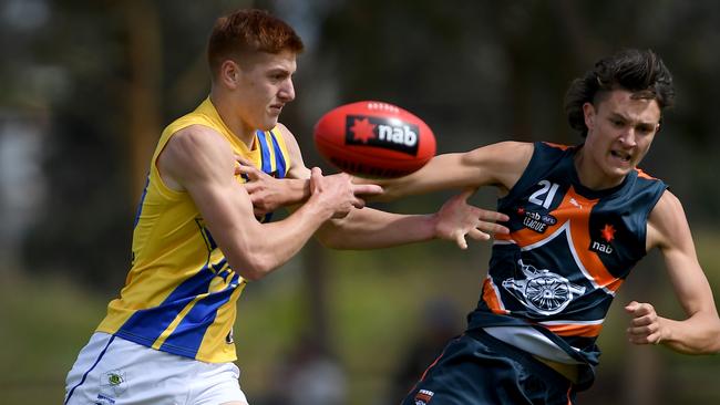 The Jets’ Nathan Dowdy and Calder’s Riley Mason battle for possession. Picture: Andy Brownbill