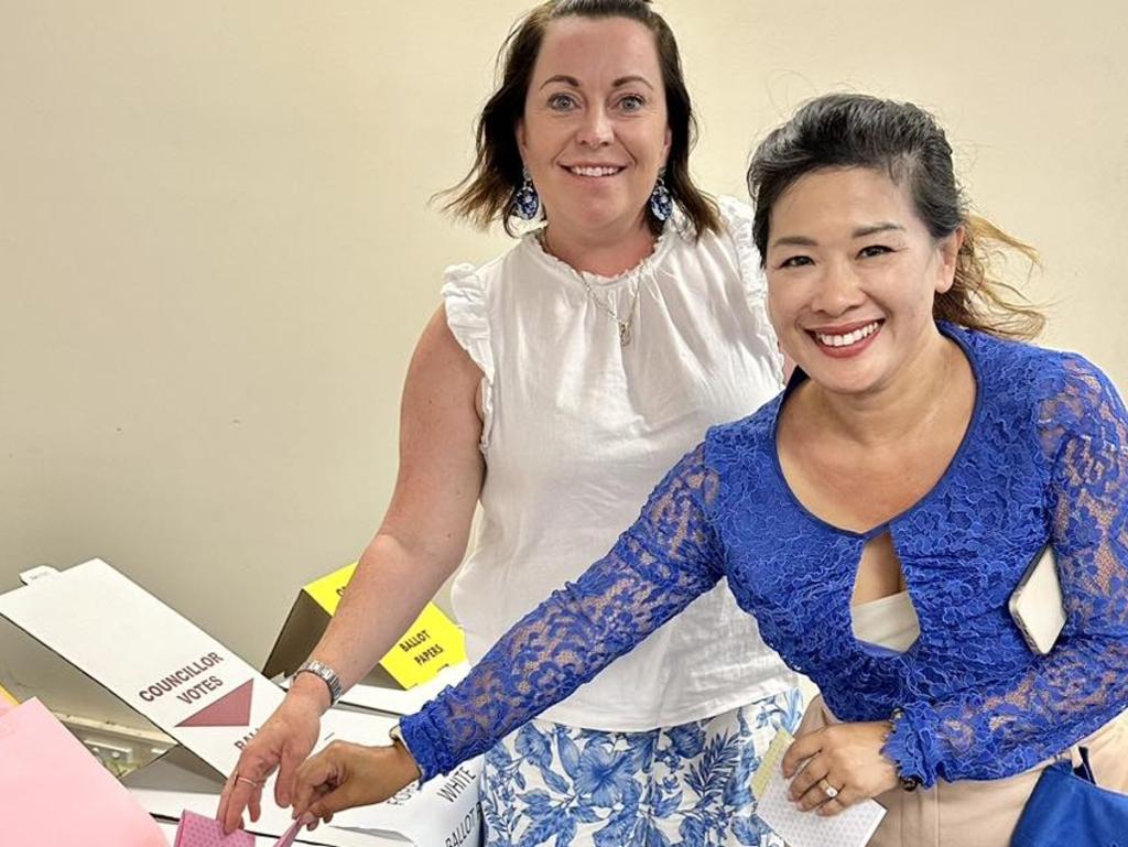 LNP Inala by-election candidate Trang Yen puts ballot papers in the box.