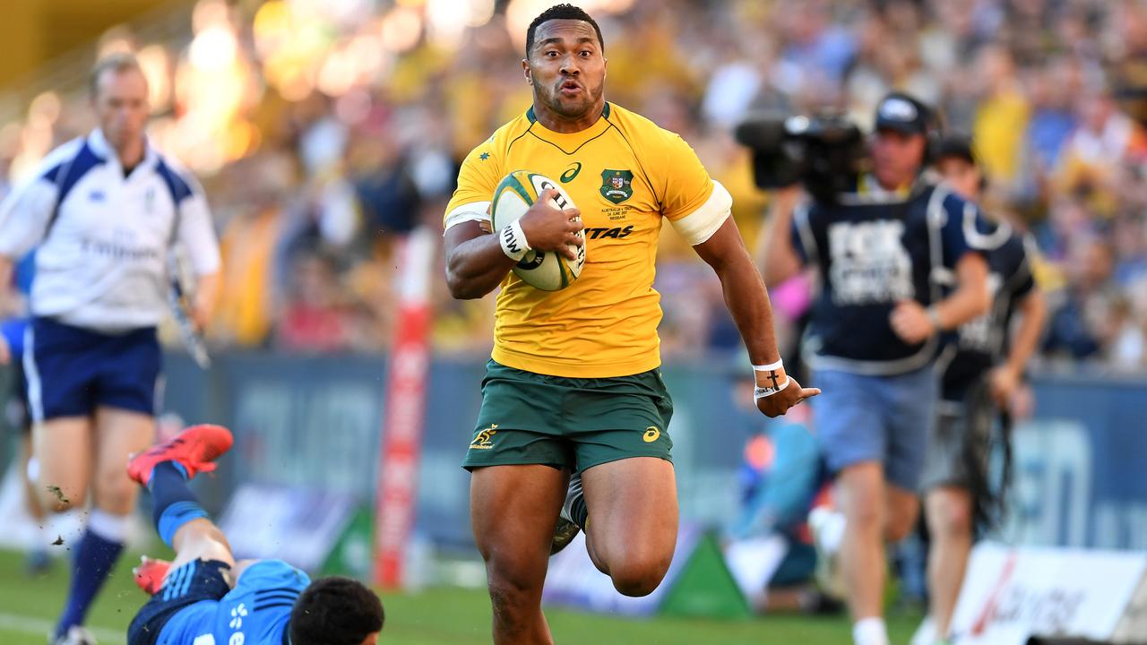 Sefa Naivalu of the Wallabies runs to score a try at Suncorp Stadium in Brisbane.