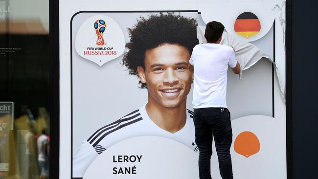 A Leroy Sane poster is taken down after he was dumped by Germany.