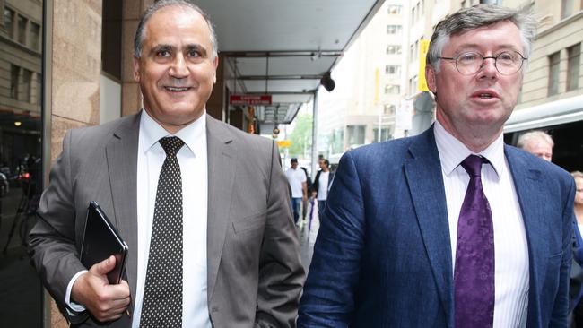 All smiles ... Cesar Melhem puts on a happy face as he leaves the royal commission. Picture: Renee Nowytarger