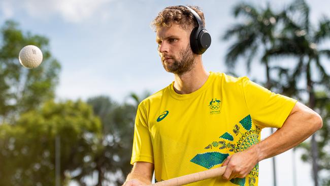 The Kookaburras are in Darwin for training before heading off to Japan for the 2020 Olympics.Josh Beltz warms up with some tunes before a session in the Darwin heat. Picture: Che Chorley