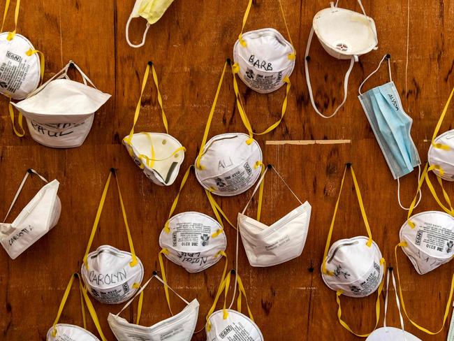 Protective masks bearing the names of medical staffers and nurses.