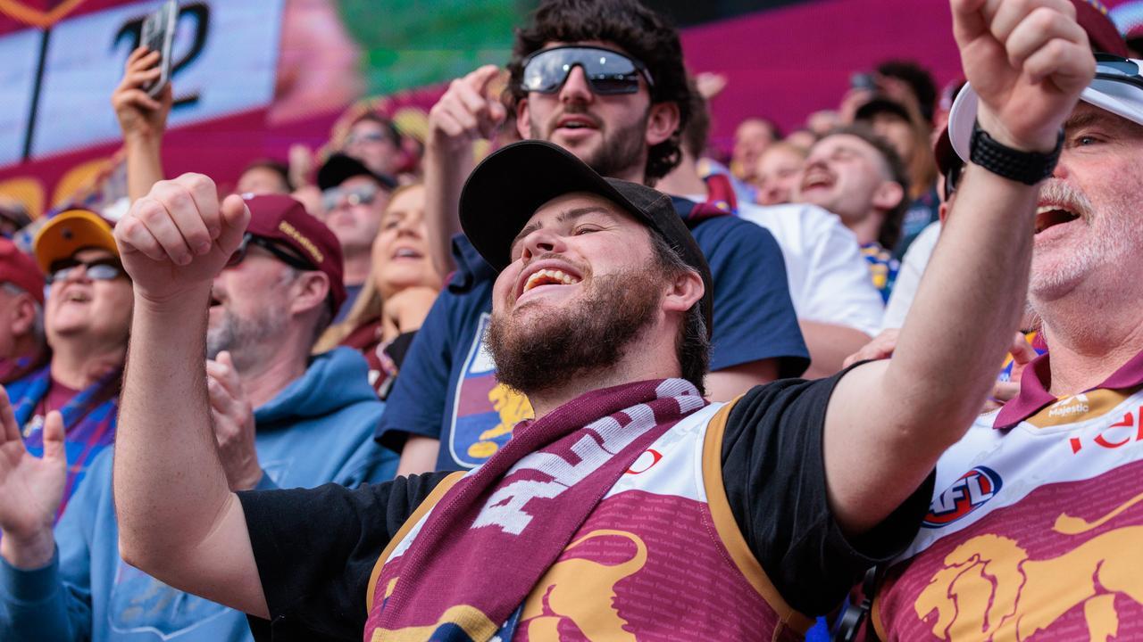 Brisbane fans celebrate after winning the game at the MCG. Picture: NewsWire/Nadir Kinani