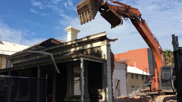 Demolition of two bluestone cottages on Hutt St, which were sacrificed to make way for an apartment tower that has since been shelved. Picture: Sandy Wilkinson