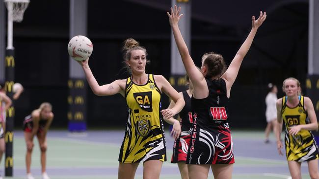 Rachel Campion looks to pass in the Cairns Netball Association Senior Division 1 match between North Cairns Tigers and Cairns Saints. PICTURE: BRENDAN RADKE