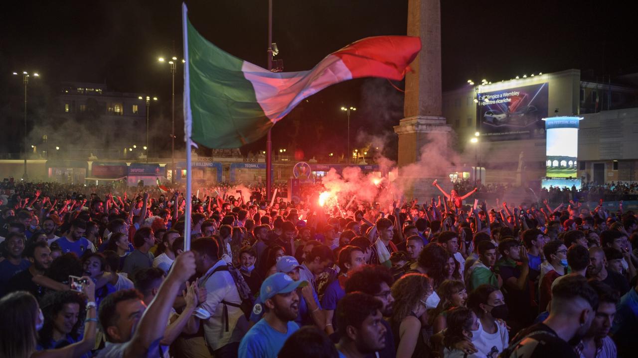 Italian fans react as they watch the Euro 2020 Final match between Italy and England, played at Wembley stadium, on giant screens at Piazza del Popolo fan zone on July 11, 2021 in Rome. Picture: Antonio Masiello/Getty Images