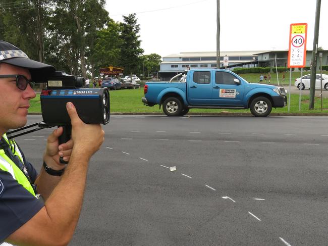 Sergeant Winfried Wiess of Atherton police on duty at the school zone outside Atherton State High School on Tuesday morning last week. David Anthony photo