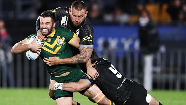 Kangaroos fullback James Tedesco is wrapped up by the Kiwi defence. Picture: Getty Images