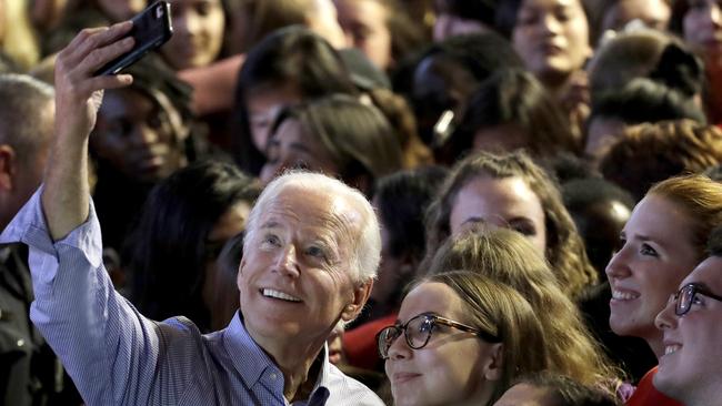 Former U.S. Vice President Joe Biden takes a selfie with students. (Pic: Julio Cortez/AP)