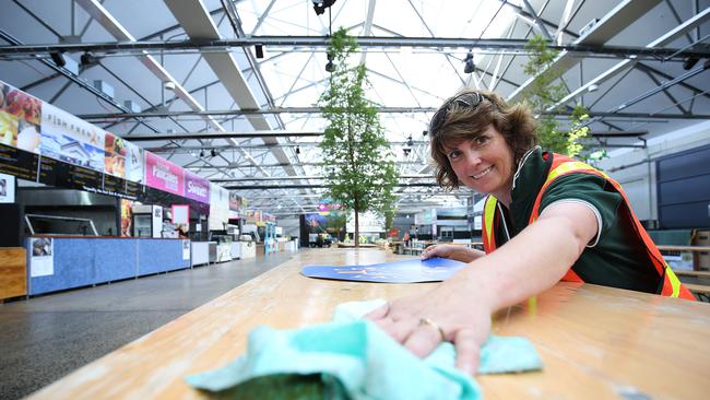 Cascade Brewery's Lisa Kean prepares tables for advertising decals in Princes Wharf for Taste of Tasmania. Picture: SAM ROSEWARNE