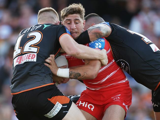 SYDNEY, AUSTRALIA - APRIL 14:  Zac Lomax of the Dragons is tackled during the round six NRL match between Wests Tigers and St George Illawarra Dragons at Campbelltown Stadium, on April 14, 2024, in Sydney, Australia. (Photo by Matt King/Getty Images)