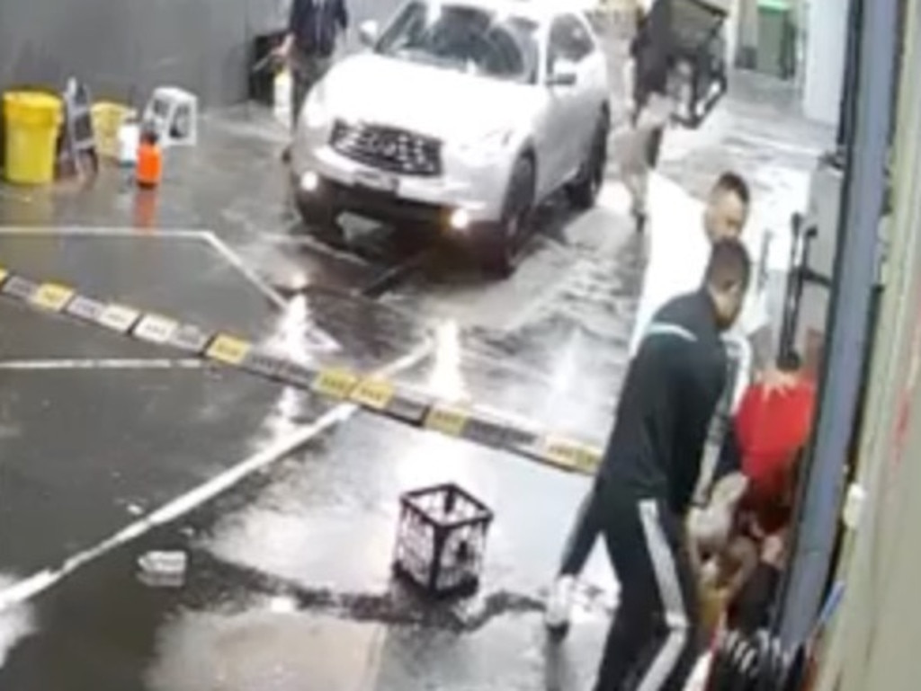 Further footage taken from a second camera angle outside showed situation escalating rapidly once two more men arrived. They began assaulting the first man up against a wall, smashing milk crates over his head, throwing punches and stomping.