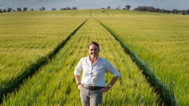 Liz O'Leary, seen in a paddock of barley, usually farms from a Sydney office — but is regarded as an astute watcher of agriculture. Picture: David Roma