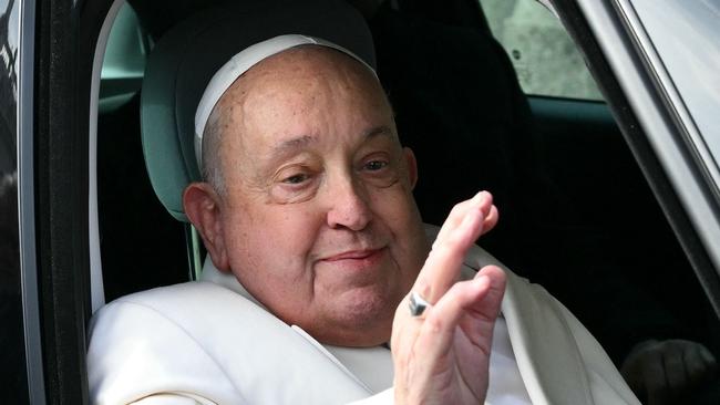 (FILES) Pope Francis arrives to celebrate the mass for the Jubilee of the Armed Forces at St. Peter's square in the Vatican on February 9, 2025. Pope Francis "slept all night long" the Vatican said on March 4, 2025 after he suffered two breathing attacks on Monday, as the 88-year-old pontiff struggles to recover from pneumonia. (Photo by Alberto PIZZOLI / AFP)