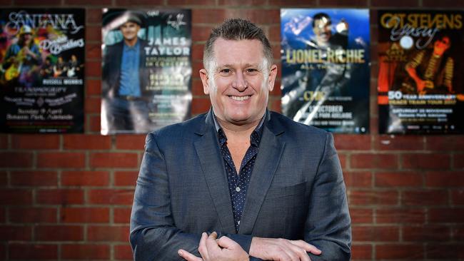 Music promoter Phil Rankine with promotional posters for some of the major acts he has brought to Adelaide. Picture: Bianca De Marchi