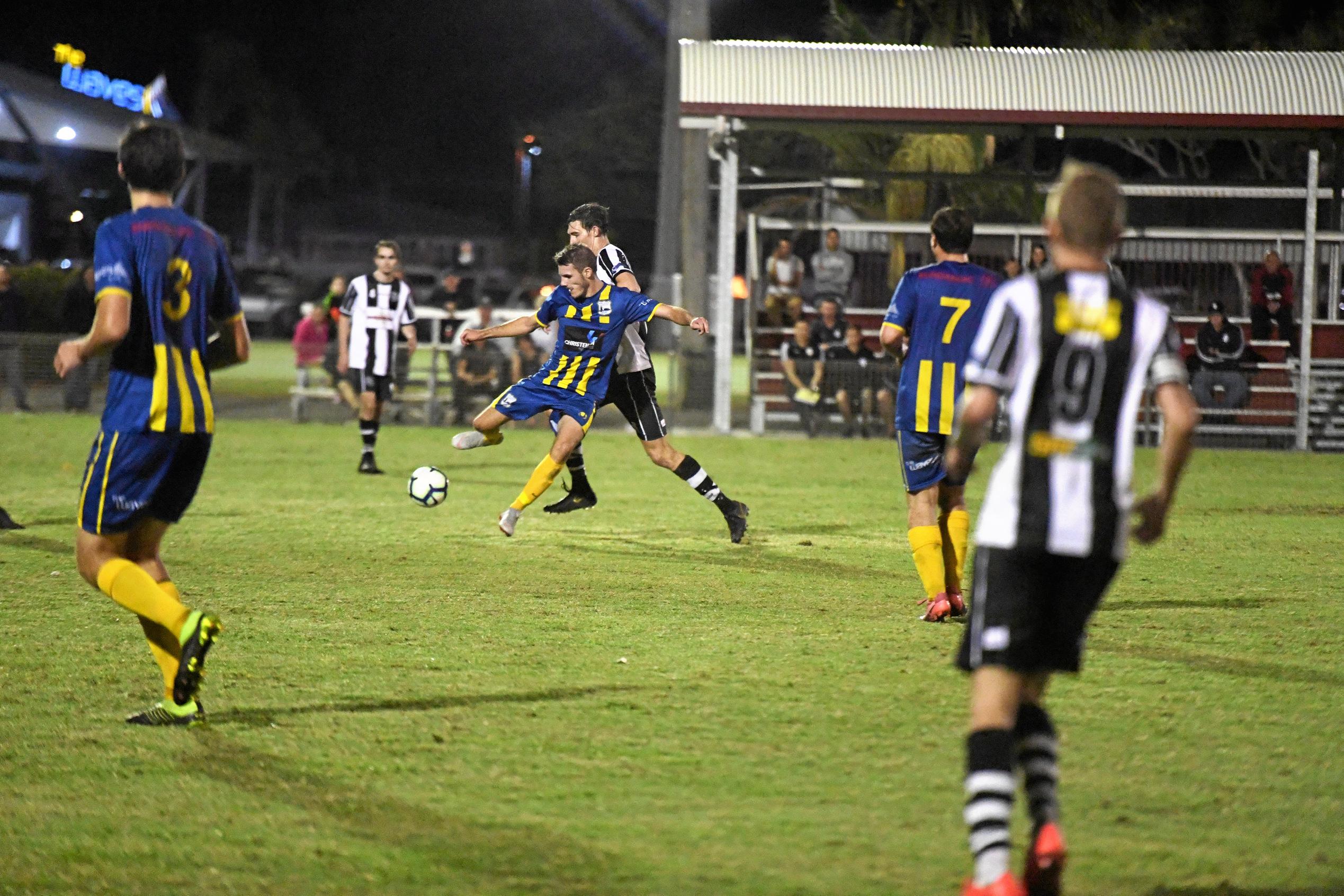 The Waves' Jacob Trudgian battles for the ball with a Bingera player. Picture: Shane Jones