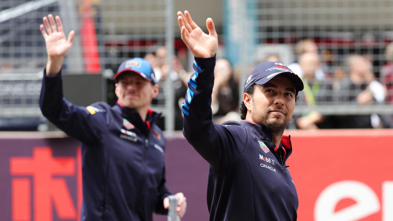 Will Verstappen (left) and Sergio Perez wave goodbye to the field from the start? (Photo by Lintao Zhang/Getty Images )