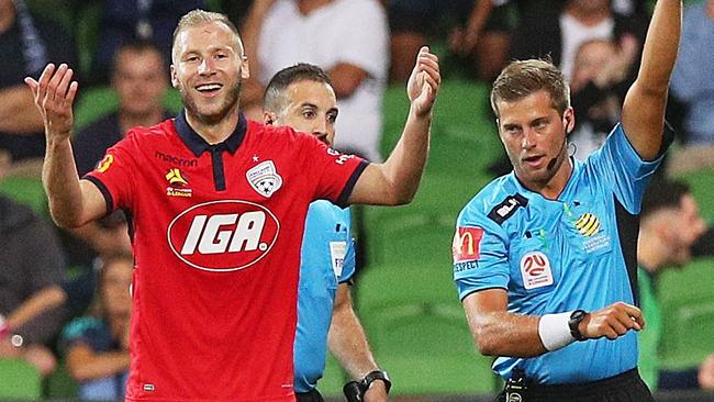 Dzengis Cavusevic of United is shown a red card by referee Alex King.