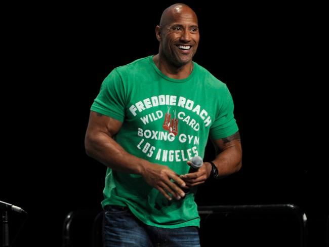No reason ... When Dwayne Johnson made a surprise appearance to promote <i>Hercules</i>, 10 women in belly-baring outfits stood on stage for no apparent reason. Picture: Chris Pizzello