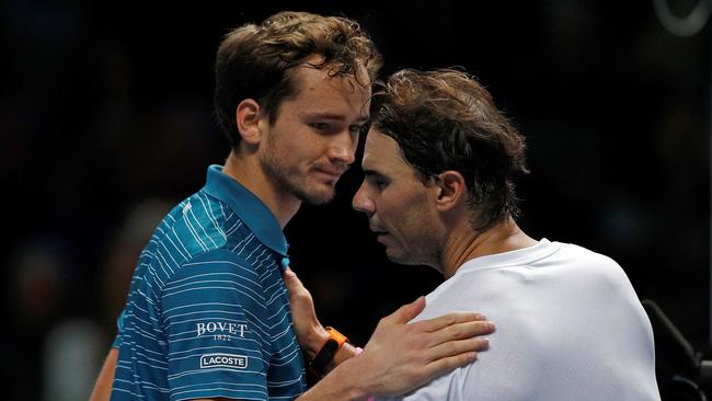 Spain's Rafael Nadal (R) shakes hands with Russia's Daniil Medvedev after winning their men's singles round-robin match on day four of the ATP World Tour Finals tennis tournament at the O2 Arena in London on November 13, 2019. – Nadal won 6-7, 6-3, 7-6. (Photo by Adrian DENNIS / AFP)