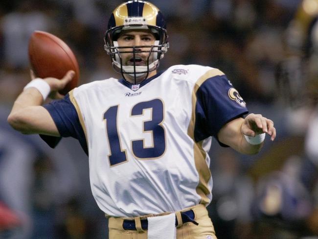 FILE - In this Feb. 3, 2002, file photo, St. Louis Rams quarterback Kurt Warner looks to pass to Marshall Faulk, right, during the first quarter against the New England Patriots in NFL football's Super Bowl XXXVI in New Orleans. The Patriots defeated the Rams 20-17. (AP Photo/Doug Mills, File)