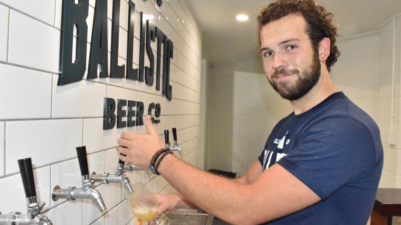 Ballistic Whitsundays bar tender Isaac Element pulling beers at the VIP launch. Picture: Kirra Grimes.